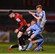 14 March 2022; Dawson Devoy of Bohemians in action against Shane Farrell and Brian McManus of Shelbourne during the SSE Airtricity League Premier Division match between Bohemians and Shelbourne at Dalymount Park in Dublin. Photo by Brendan Moran/Sportsfile