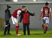 14 March 2022; Mark Doyle of St Patrick's Athletic poses for a picture with a supporter after his side's victory in the SSE Airtricity League Premier Division match between St Patrick's Athletic and UCD at Richmond Park in Dublin. Photo by Piaras Ó Mídheach/Sportsfile