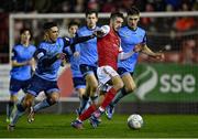 14 March 2022; Jack Scott of St Patrick's Athletic in action against Sean Brennan of UCD, left, during the SSE Airtricity League Premier Division match between St Patrick's Athletic and UCD at Richmond Park in Dublin. Photo by Piaras Ó Mídheach/Sportsfile