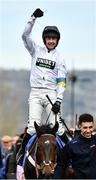 15 March 2022; Jockey Nico de Boinville celebrates after winning the Sky Bet Supreme Novices' Hurdle on Constitution Hill, as they are lead into the parade ring by Jaydon Lee, during day one of the Cheltenham Racing Festival at Prestbury Park in Cheltenham, England. Photo by Seb Daly/Sportsfile