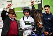15 March 2022; Jockey Nico de Boinville, trainer Nickey Henderson and handler Jaydon Lee celebrate after winning the Sky Bet Supreme Novices' Hurdle with Constitution Hill during day one of the Cheltenham Racing Festival at Prestbury Park in Cheltenham, England. Photo by Seb Daly/Sportsfile
