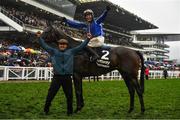 16 March 2022; Jockey Paul Townend, and groom Imran Haider, celebrate after winning the Betway Queen Mother Champion Chase with Energumene on day two of the Cheltenham Racing Festival at Prestbury Park in Cheltenham, England. Photo by Seb Daly/Sportsfile