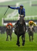16 March 2022; Jockey Paul Townend, on Energumene, celebrates winning the Betway Queen Mother Champion Chase on day two of the Cheltenham Racing Festival at Prestbury Park in Cheltenham, England. Photo by Seb Daly/Sportsfile