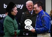 16 March 2022; Princess Anne, Princess Royal, presents the jockeys winning plate to Paul Townend after winning the Betway Queen Mother Champion Chase with Energumene as trainer Willie Mullins watches on during day two of the Cheltenham Racing Festival at Prestbury Park in Cheltenham, England. Photo by David Fitzgerald/Sportsfile