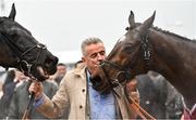16 March 2022; Owner Michael O'Leary with the winner of Glenfarclas Cross Country Chase, Delta Work, left, and second place Tiger Roll, right, on day two of the Cheltenham Racing Festival at Prestbury Park in Cheltenham, England. Photo by David Fitzgerald/Sportsfile