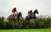 16 March 2022; Tiger Roll, with Davy Russell up, left, leads the eventual winner Delta Work, with Jack Kennedy up, right, over the last during the Glenfarclas Cross Country Chase on day two of the Cheltenham Racing Festival at Prestbury Park in Cheltenham, England. Photo by David Fitzgerald/Sportsfile