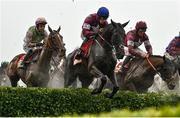 16 March 2022; Eventual winner Delta Work, with Jack Kennedy up, second from left, jumps alongside eventual second place Tiger Roll, with Davy Russell up, third from left, during the Glenfarclas Cross Country Chase on day two of the Cheltenham Racing Festival at Prestbury Park in Cheltenham, England. Photo by David Fitzgerald/Sportsfile