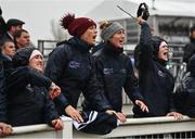 16 March 2022; Stable hands from trainer Gordon Elliott's year including Camilla Sharples, centre, cheer on Delta Work and Tiger Roll in the Glenfarclas Cross Country Chase on day two of the Cheltenham Racing Festival at Prestbury Park in Cheltenham, England. Photo by David Fitzgerald/Sportsfile