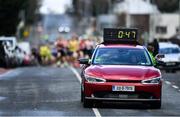 17 March 2022; The Kia EV6 lead car leads the runners during the Kia Race Series 5k of Portlaoise in Laois. Photo by Ben McShane/Sportsfile