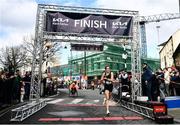 17 March 2022; Aoife Cooke of Eagle AC, Cork, crosses the line as first place female of the Kia Race Series 5k of Portlaoise in Laois. Photo by Ben McShane/Sportsfile