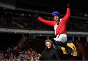 17 March 2022; Jockey Paul Townend celebrates after riding Allaho to victory in the Ryanair Chase, in the company of groom Ruth Dudfield, on day three of the Cheltenham Racing Festival at Prestbury Park in Cheltenham, England. Photo by David Fitzgerald/Sportsfile