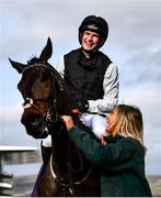 17 March 2022; Jockey Danny Mullins celebrates after riding Flooring Porter to victory in the Paddy Power Stayers' Hurdle, with groom Caragh Monaghan, on day three of the Cheltenham Racing Festival at Prestbury Park in Cheltenham, England. Photo by David Fitzgerald/Sportsfile