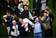 17 March 2022; Jockey Danny Mullins is lifted in celebration by winning connections of Flooring Porter, including Kerril Creaven, left, and James Skehill, second from left, after winning the Paddy Power Stayers' Hurdle on day three of the Cheltenham Racing Festival at Prestbury Park in Cheltenham, England. Photo by David Fitzgerald/Sportsfile