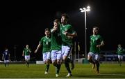 17 March 2022; Michael Ragget of Republic of Ireland, centre, celebrates after scoring his side's second goal with teammates Michael Keyes and Michael McCullagh during the Inspiresport Centenary Shield match between Republic of Ireland and Scotland at Home Farm FC in Dublin. Photo by Harry Murphy/Sportsfile