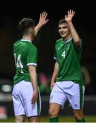 17 March 2022; Eanna Clancy, right, and Darragh Reilly of Republic of Ireland high five after their side's victory in the Inspiresport Centenary Shield match between Republic of Ireland and Scotland at Home Farm FC in Dublin. Photo by Harry Murphy/Sportsfile