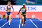 18 March 2022; Molly Scott of Ireland, right, alongside Guðbjörg Jóna Bjarnadóttir of Iceland, competing in the women's 60m during day one of the World Indoor Athletics Championships at the Štark Arena in Belgrade, Serbia. Photo by Sam Barnes/Sportsfile