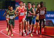 18 March 2022; Darragh McElhinney of Ireland, centre, competing in the men's 3000m, alongside Jordan Gusman of Malta, left, and Daniel Simiu Ebenyo of Kenya, right,  during day one of the World Indoor Athletics Championships at the Štark Arena in Belgrade, Serbia. Photo by Sam Barnes/Sportsfile