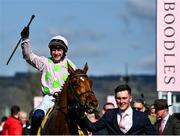 18 March 2022; Jockey Paul Townend celebrates after riding Vauban to victory in the JCB Triumph Hurdle with groom Adam Connolly during day four of the Cheltenham Racing Festival at Prestbury Park in Cheltenham, England. Photo by David Fitzgerald/Sportsfile