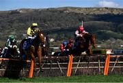 18 March 2022; State Man, with Paul Townend up, left, on their way to winning the McCoy Contractors County Handicap Hurdle ahead of Colonel Mustard, with Conor Orr up, during day four of the Cheltenham Racing Festival at Prestbury Park in Cheltenham, England. Photo by David Fitzgerald/Sportsfile