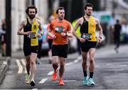 17 March 2022; Runners, from left, Padraig Ruane of Kilkenny City Harriers, Thomas Geoghegan of St Coca's AC, Kildare, and Eamon O'Connor of Kilkenny City Harriers AC, warm-up before the Kia Race Series 5k of Portlaoise in Laois. Photo by Ben McShane/Sportsfile