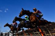 18 March 2022; Runners and riders, from left, Top Bandit, with Davy Russell up, Farout with Brian Hayes up, and Faivoir, with Bridget Andrews up, jump the last during the McCoy Contractors County Handicap Hurdle on day four of the Cheltenham Racing Festival at Prestbury Park in Cheltenham, England. Photo by David Fitzgerald/Sportsfile