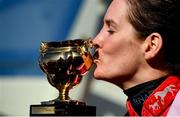 18 March 2022; Rachael Blackmore kisses the Gold Cup after winning the Boodles Cheltenham Gold Cup Chase aboard A Plus Tard during day four of the Cheltenham Racing Festival at Prestbury Park in Cheltenham, England. Photo by Seb Daly/Sportsfile