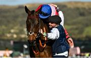 18 March 2022; Rachael Blackmore aboard A Plus Tard, and groom John Ferguson celebrate after winning the Boodles Cheltenham Gold Cup Chase during day four of the Cheltenham Racing Festival at Prestbury Park in Cheltenham, England. Photo by Seb Daly/Sportsfile Photo by Seb Daly/Sportsfile