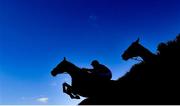 18 March 2022; A Plus Tard, with Rachael Blackmore up, left, leads eventual second placed Minella Indo, with Robbie Power up, over the last on their way to winning the Boodles Cheltenham Gold Cup Chase during day four of the Cheltenham Racing Festival at Prestbury Park in Cheltenham, England. Photo by David Fitzgerald/Sportsfile