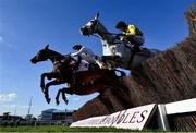 18 March 2022; Aye Right, with Callum Bewley up, left, and Asterion Forlonge up, with Bryan Cooper up, jump the last first time round during the Boodles Cheltenham Gold Cup Chase during day four of the Cheltenham Racing Festival at Prestbury Park in Cheltenham, England. Photo by David Fitzgerald/Sportsfile Photo by David Fitzgerald/Sportsfile
