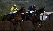 18 March 2022; Billaway, with Patrick Mullins up, left, jumps the last, alongside Back Bar, with Miss Izzie Marshall up, on their way to winning the St James's Place Festival Challenge Cup Open Hunters' Chase during day four of the Cheltenham Racing Festival at Prestbury Park in Cheltenham, England. Photo by David Fitzgerald/Sportsfile