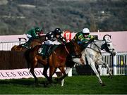 18 March 2022; Elimay, with Mark Walsh up, right, alongside Mount Ida, with Davy Russell up, left, on their way to winning the Mrs Paddy Power Mares' Chase during day four of the Cheltenham Racing Festival at Prestbury Park in Cheltenham, England. Photo by David Fitzgerald/Sportsfile