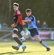 18 March 2022; Stephen Mallon of Bohemians flicks the ball over Alex Dunne of UCD during the SSE Airtricity League Premier Division match between UCD and Bohemians at UCD Bowl in Belfield, Dublin. Photo by Brendan Moran/Sportsfile