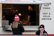 18 March 2022; A young Derry City supporter tucks into his chips before the SSE Airtricity League Premier Division match between Derry City and St Patrick's Athletic at The Ryan McBride Brandywell Stadium in Derry. Photo by Stephen McCarthy/Sportsfile