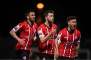 18 March 2022; Will Patching of Derry City, centre, celebrates after scoring his side's first goal with Daniel Lafferty, left, and Cameron McJannet, right, during the SSE Airtricity League Premier Division match between Derry City and St Patrick's Athletic at The Ryan McBride Brandywell Stadium in Derry. Photo by Stephen McCarthy/Sportsfile