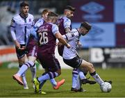 18 March 2022; Joe Adams of Dundalk is tackled by Georgie Poynton, left, and Adam Foley of Drogheda United during the SSE Airtricity League Premier Division match between Drogheda United and Dundalk at Head in the Game Park in Drogheda, Louth. Photo by Ramsey Cardy/Sportsfile