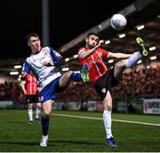 18 March 2022; Danny Lafferty of Derry City in action against Darragh Burns of St Patrick's Athletic during the SSE Airtricity League Premier Division match between Derry City and St Patrick's Athletic at The Ryan McBride Brandywell Stadium in Derry. Photo by Stephen McCarthy/Sportsfile