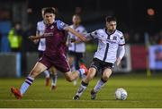 18 March 2022; Joe Adams of Dundalk in action against James Clarke of Drogheda United during the SSE Airtricity League Premier Division match between Drogheda United and Dundalk at Head in the Game Park in Drogheda, Louth. Photo by Ramsey Cardy/Sportsfile