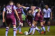 18 March 2022; Patrick Hoban is tackled by James Clarke, left, and Mark Connolly of Dundalk during the SSE Airtricity League Premier Division match between Drogheda United and Dundalk at Head in the Game Park in Drogheda, Louth. Photo by Ramsey Cardy/Sportsfile