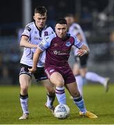 18 March 2022; Chris Lyons of Drogheda United in action against Lewis Macari of Dundalk during the SSE Airtricity League Premier Division match between Drogheda United and Dundalk at Head in the Game Park in Drogheda, Louth. Photo by Ramsey Cardy/Sportsfile
