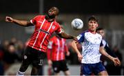 18 March 2022; James Akintunde of Derry City in action against Joe Redmond of St Patrick's Athletic during the SSE Airtricity League Premier Division match between Derry City and St Patrick's Athletic at The Ryan McBride Brandywell Stadium in Derry. Photo by Stephen McCarthy/Sportsfile