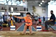 19 March 2022; Caoimhe Mc Gonagle of Rosses AC, Donegal, competing in the women's U12 long jump on day one of the Irish Life Health National Juvenile Indoors at Athlone Institute of Technology in Athlone, Westmeath. Photo by Ben McShane/Sportsfile