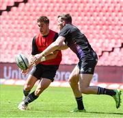 19 March 2022; Jack Crowley, left, and Chris Farrell of Munster warm up before the United Rugby Championship match between Emirates Lions and Munster at Emirates Airline Park in Johannesburg, South Africa. Photo by Sydney Seshibedi/Sportsfile