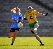 19 March 2022; Yvonne Bonnar of Donegal kicks a point under pressure from Martha Byrne of Dublin during the Lidl Ladies Football National League Division 1 Semi-Final match between Dublin and Donegal at St Tiernach's Park in Clones, Monaghan. Photo by Ray McManus/Sportsfile