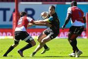 19 March 2022; Chris Farrell of Muncter in action against Burger Odendaal, left, and Sti Sithole of Emirates Lions during the United Rugby Championship match between Emirates Lions and Munster at Emirates Airline Park in Johannesburg, South Africa. Photo by Sydney Seshibedi/Sportsfile