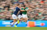19 March 2022; Hugo Keenan of Ireland is tackled by Chris Harris of Scotland during the Guinness Six Nations Rugby Championship match between Ireland and Scotland at Aviva Stadium in Dublin. Photo by Ramsey Cardy/Sportsfile