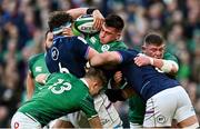 19 March 2022; Dan Sheehan of Ireland, supported by Garry Ringrose and Tadhg Furlong, is tackled by Rory Darge, left, and Grant Gilchrist of Scotland during the Guinness Six Nations Rugby Championship match between Ireland and Scotland at Aviva Stadium in Dublin. Photo by Ramsey Cardy/Sportsfile