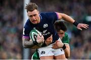 19 March 2022; Stuart Hogg of Scotland is tackled by Dan Sheehan of Ireland during the Guinness Six Nations Rugby Championship match between Ireland and Scotland at Aviva Stadium in Dublin. Photo by Brendan Moran/Sportsfile