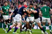 19 March 2022; Bundee Aki of Ireland is tackled by Grant Gilchrist, left, and Pierre Schoeman of Scotland during the Guinness Six Nations Rugby Championship match between Ireland and Scotland at Aviva Stadium in Dublin. Photo by Brendan Moran/Sportsfile