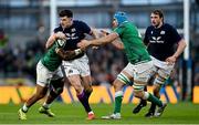 19 March 2022; Blair Kinghorn of Scotland in action against Bundee Aki, left, and Tadhg Beirne of Ireland during the Guinness Six Nations Rugby Championship match between Ireland and Scotland at Aviva Stadium in Dublin. Photo by Ramsey Cardy/Sportsfile