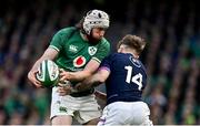 19 March 2022; Mack Hansen of Ireland is tackled by Darcy Graham of Scotland during the Guinness Six Nations Rugby Championship match between Ireland and Scotland at Aviva Stadium in Dublin. Photo by Brendan Moran/Sportsfile